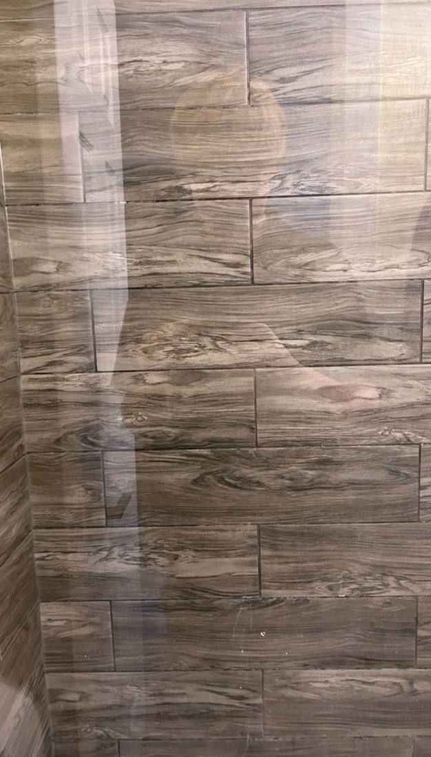 Clear shower glass after hard water stain removal
