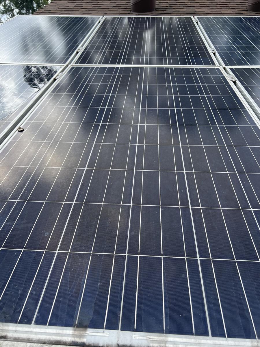 Solar panels before cleaning, streaked with grime